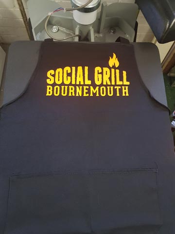 Social Grill Bournemouth, bbq, food, catering, apron, pocket, neon, orange, vinyl, transfer, heat press, printed, t-shirt printing, Bournemouth, Poole, Dorset, text